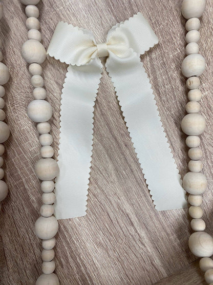 Scalloped Long Tail Bow